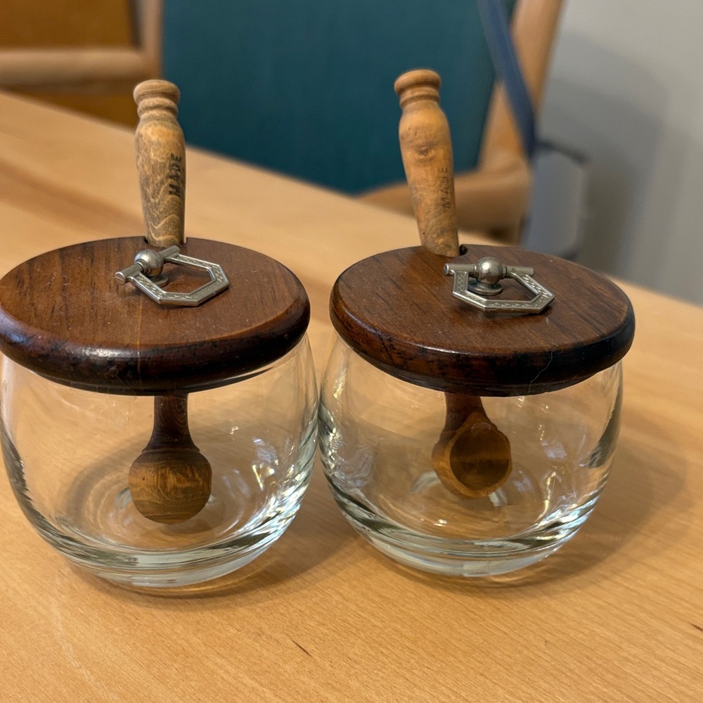 Vintage MCM glass condiment jars with wooden spoon and wood cover. Set of two.